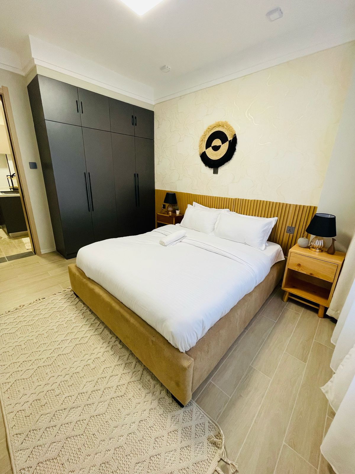 1 bedroom apartment bedroom with double bed, wardrobe and bedside lighting