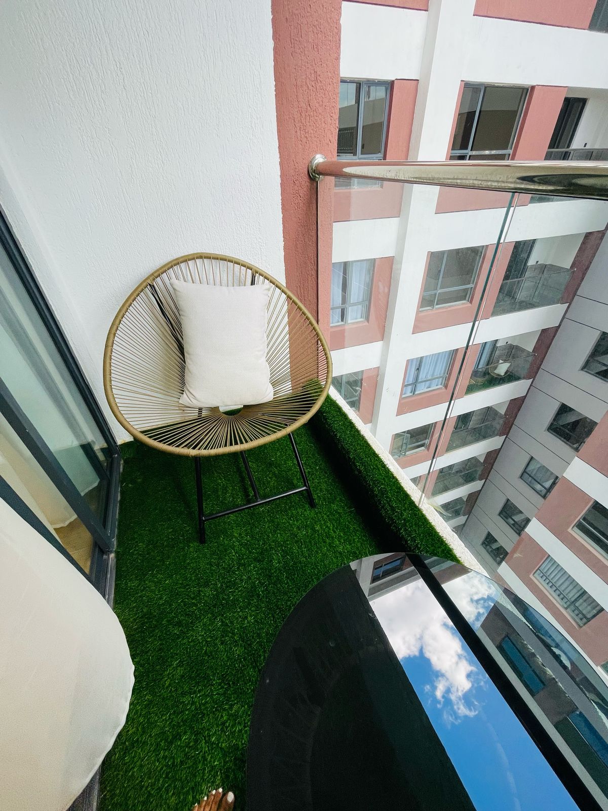 Private balcony with seating at the 1 bedroom apartment