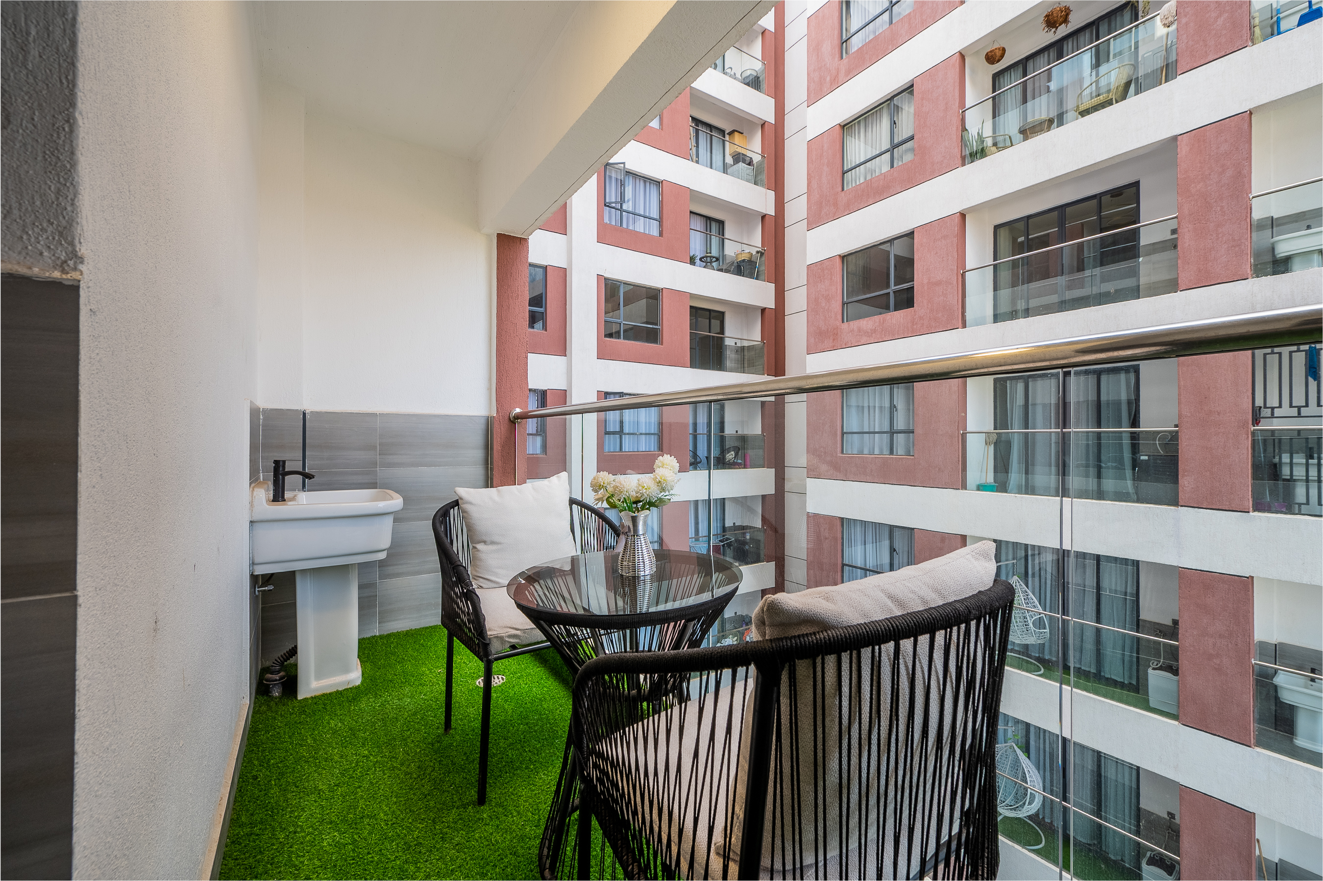 Private balcony with outdoor seating and views from the 2 bedroom apartment