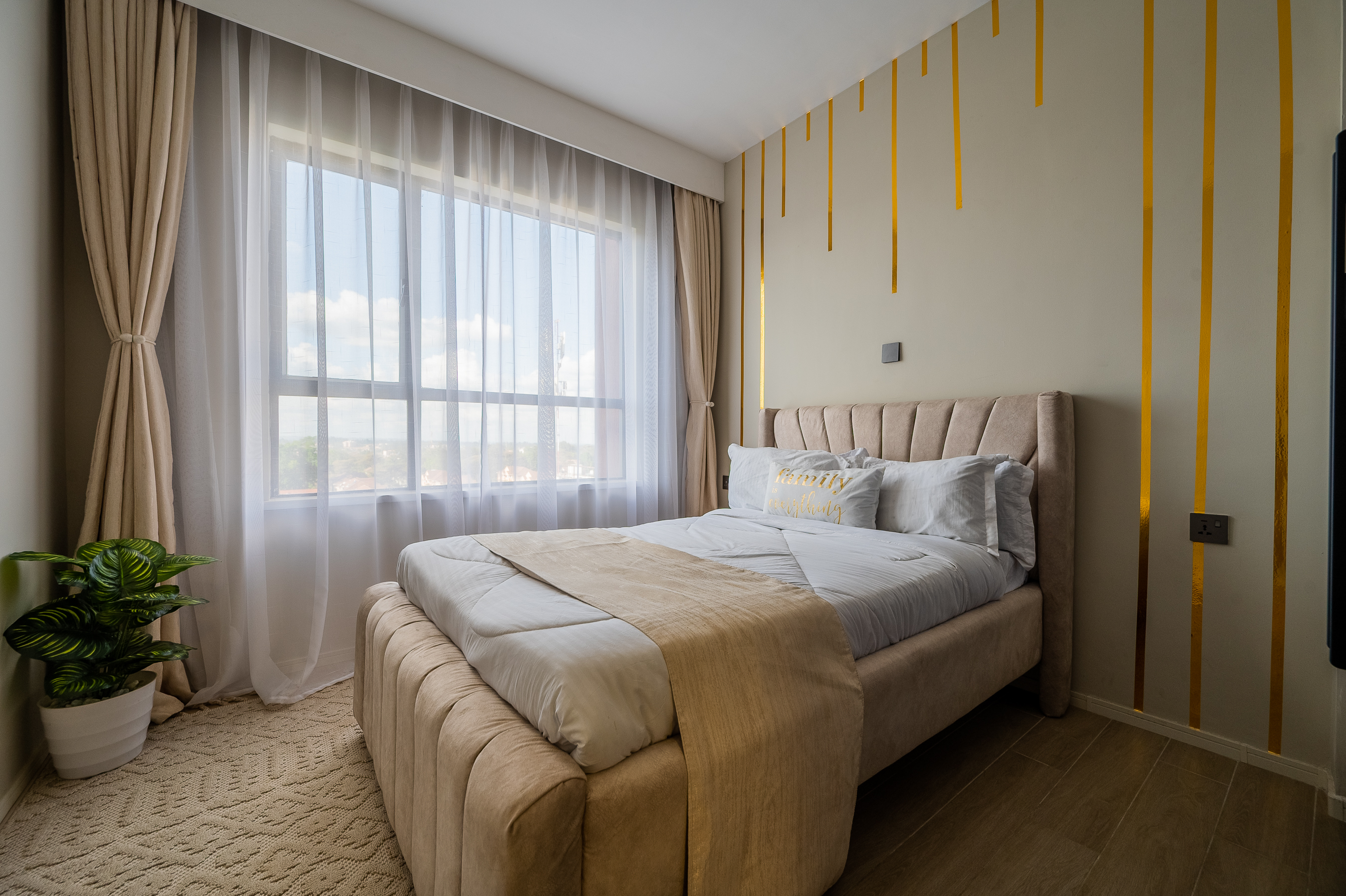Second bedroom furnished with beds and storage space