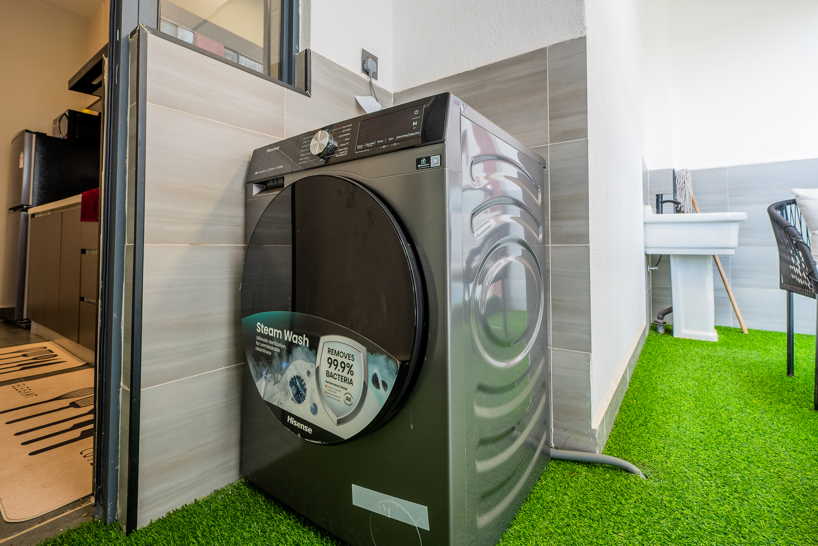 In-unit washing machine in the 2 bedroom apartment utility area