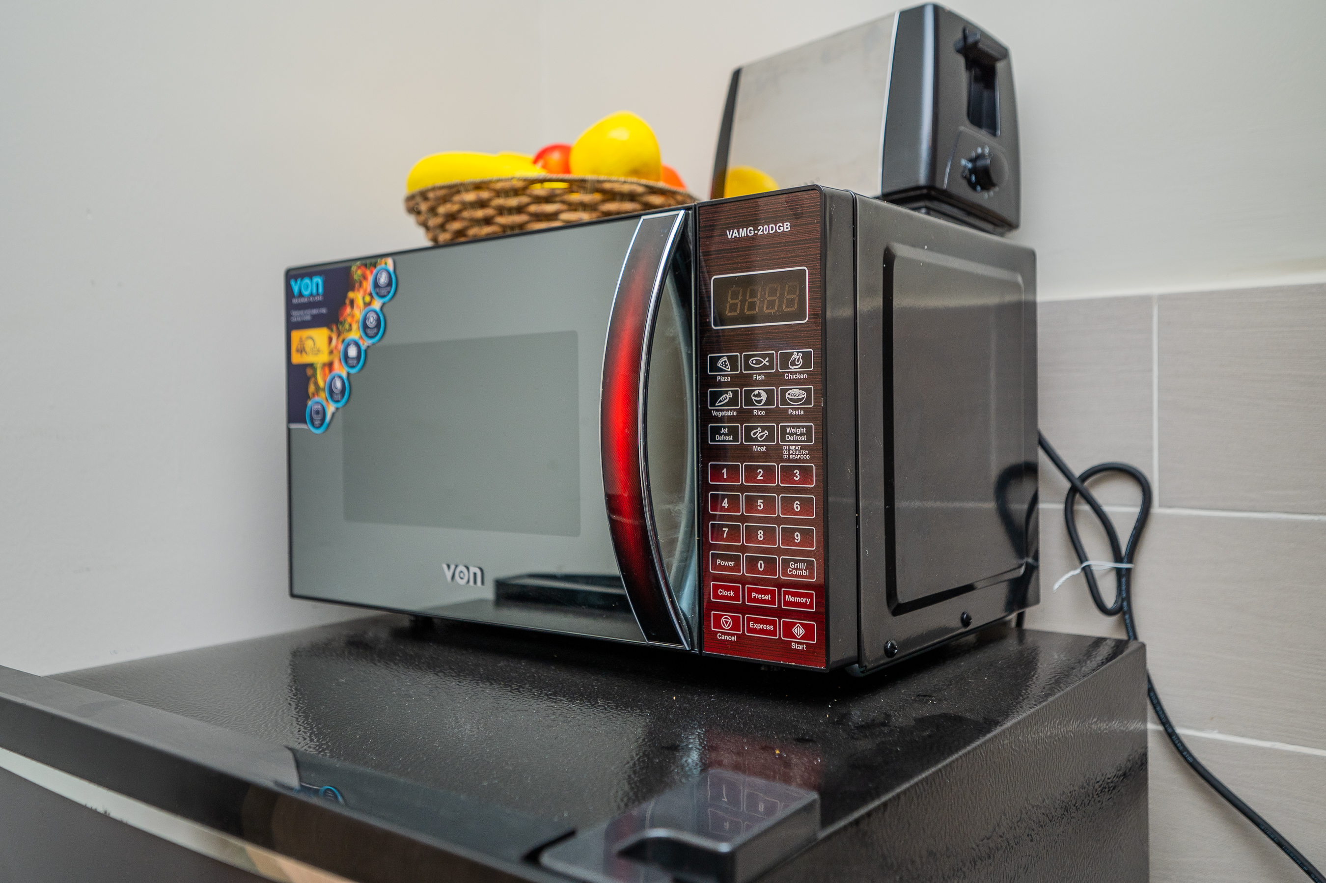 Kitchen appliances including cooker and hood in the 2 bedroom apartment