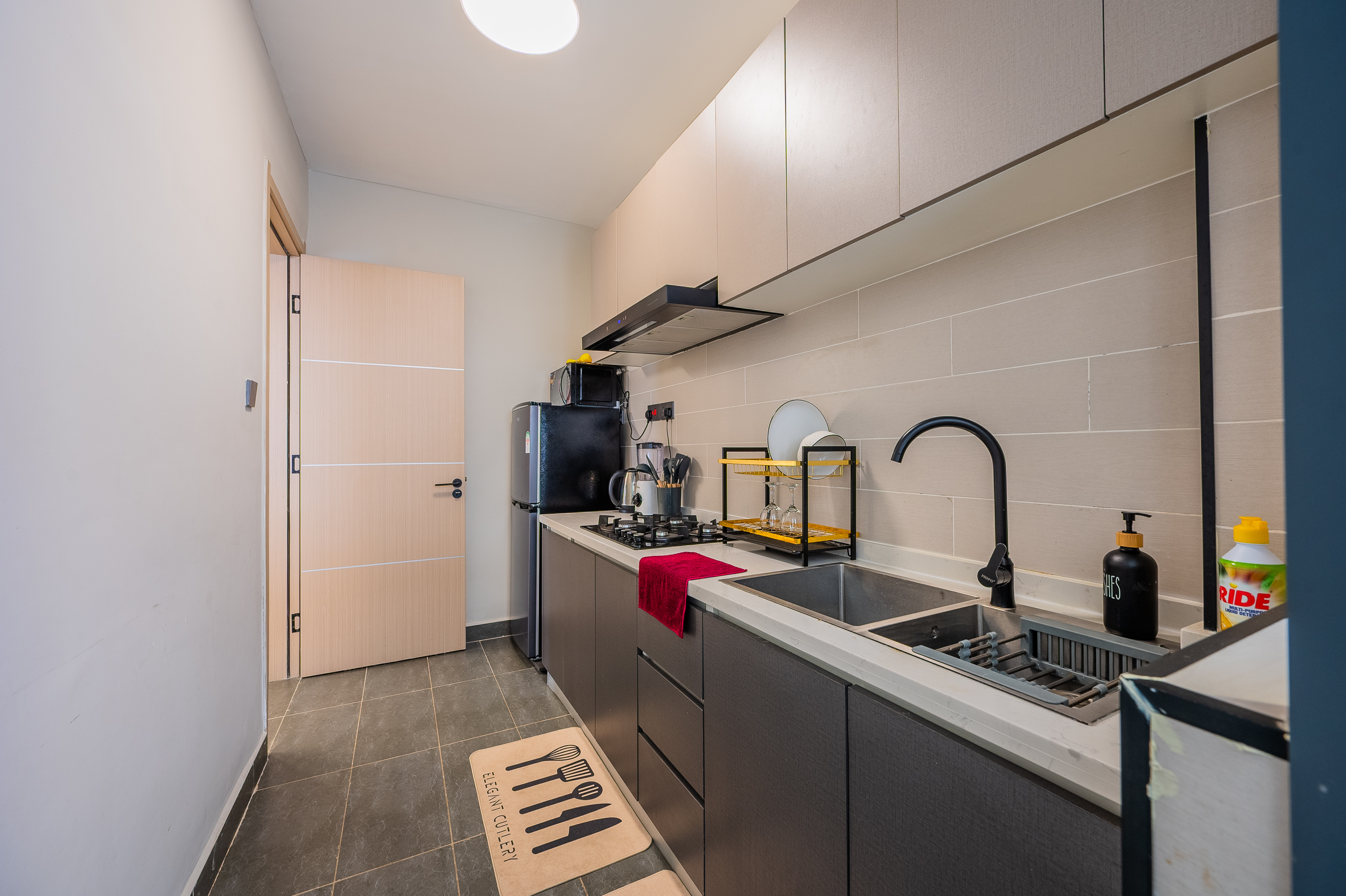 Modern kitchen and dining area with fitted cabinets and appliances